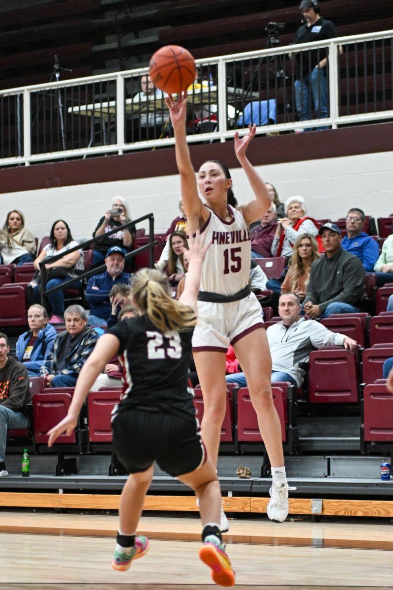 Pineville's Ava Arnett put up a shot over Harlan County's Whitney Noe in action Friday from the Chain Rock Classic. Arnett scored 29 points in the Lady Lions' 50-27 win.