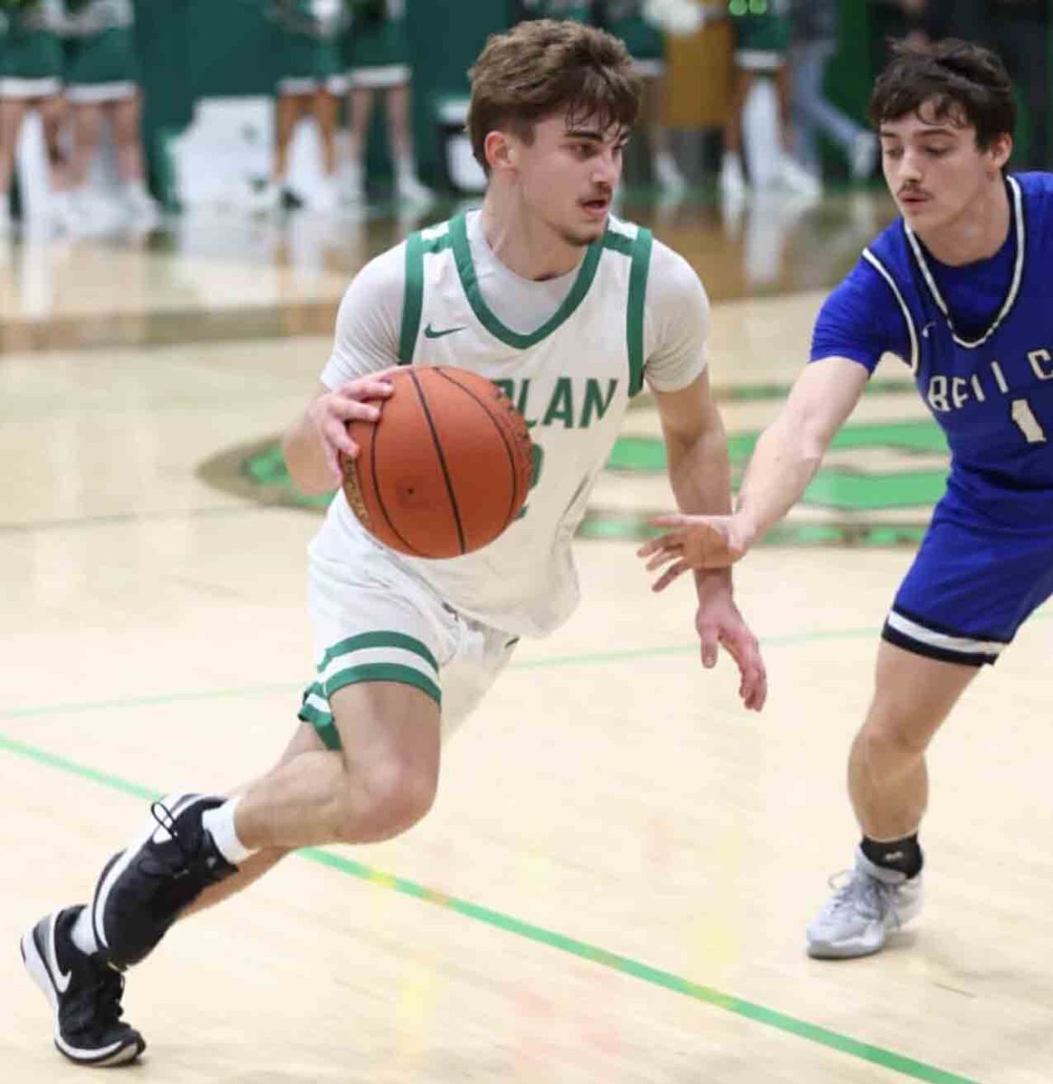 Harlan freshman guard Ethan Huff worked around a Bell County defender on Tuesday. Huff led the Dragons with 15 points in a 76-41 loss.