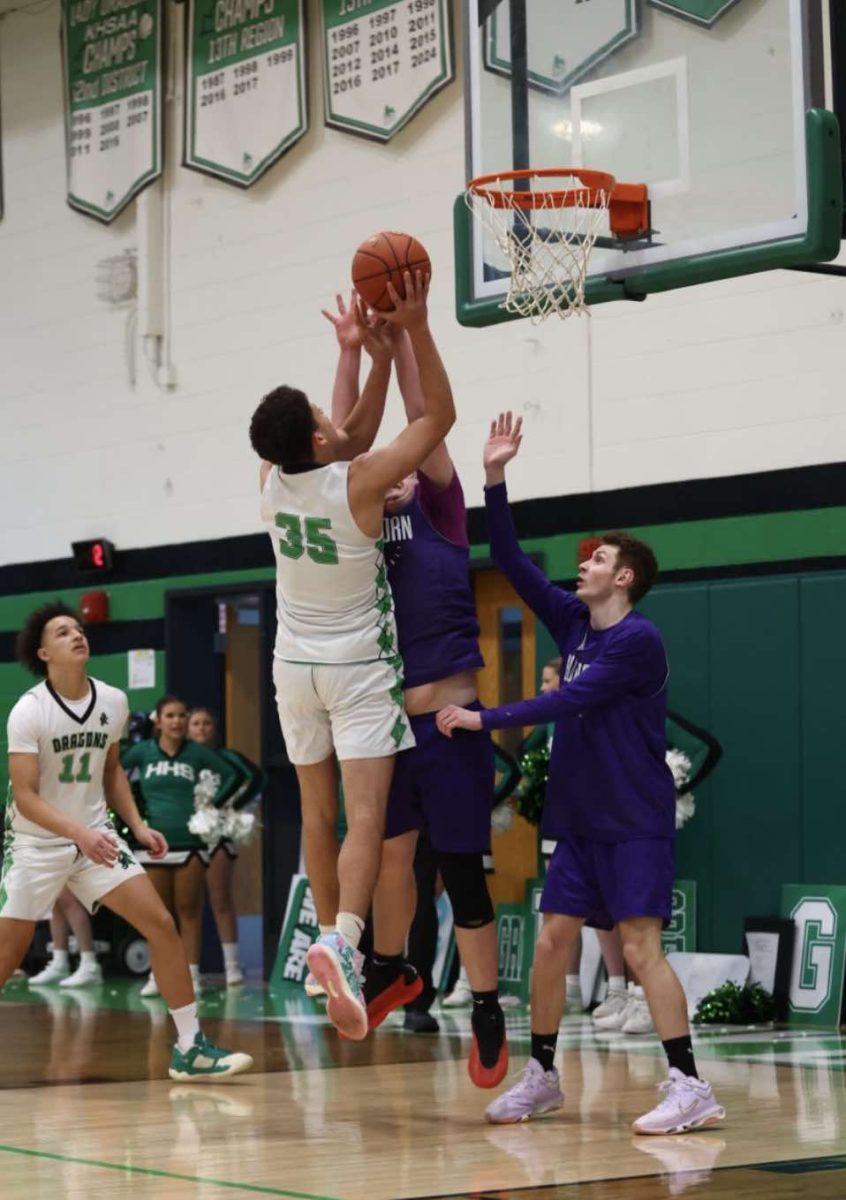 Harlan freshman center Kobe Noe, pictured in action earlier this season, scored 19 points Friday in the Green Dragons' loss to East Jessamine in the State Farm Holiday Basketball Tournament.