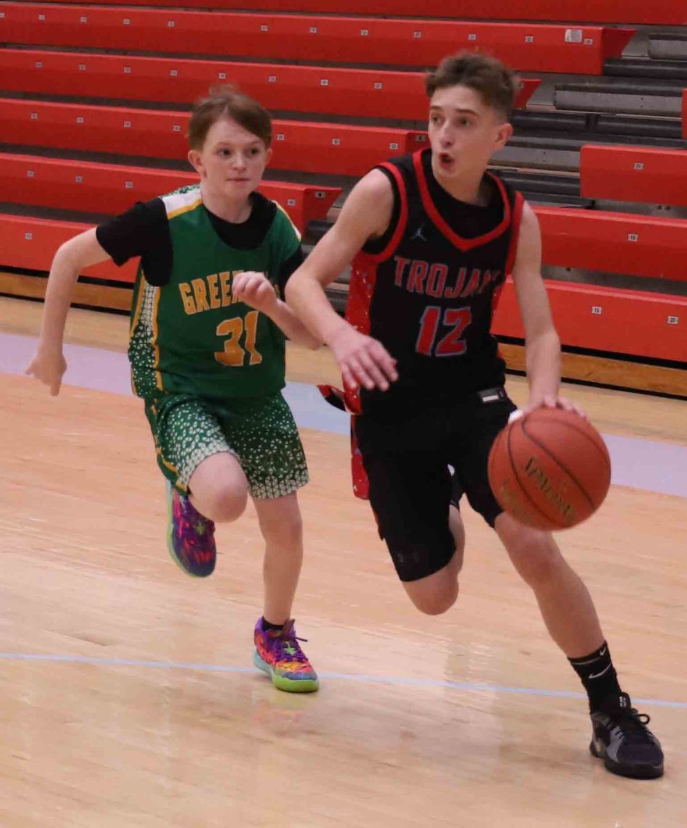 James A. Cawood guard Easton Engle drove around a Green Hills defender in Thursday's game. Engle scored 19 points in the Trojans' 57-29 victory.