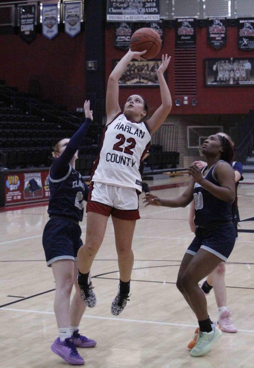 Harlan County freshman guard Kylee Runions sliced between two Claiborne, Tenn., defenders for two of her team-high 21 points in the Lady Bears' 60-47 victory.