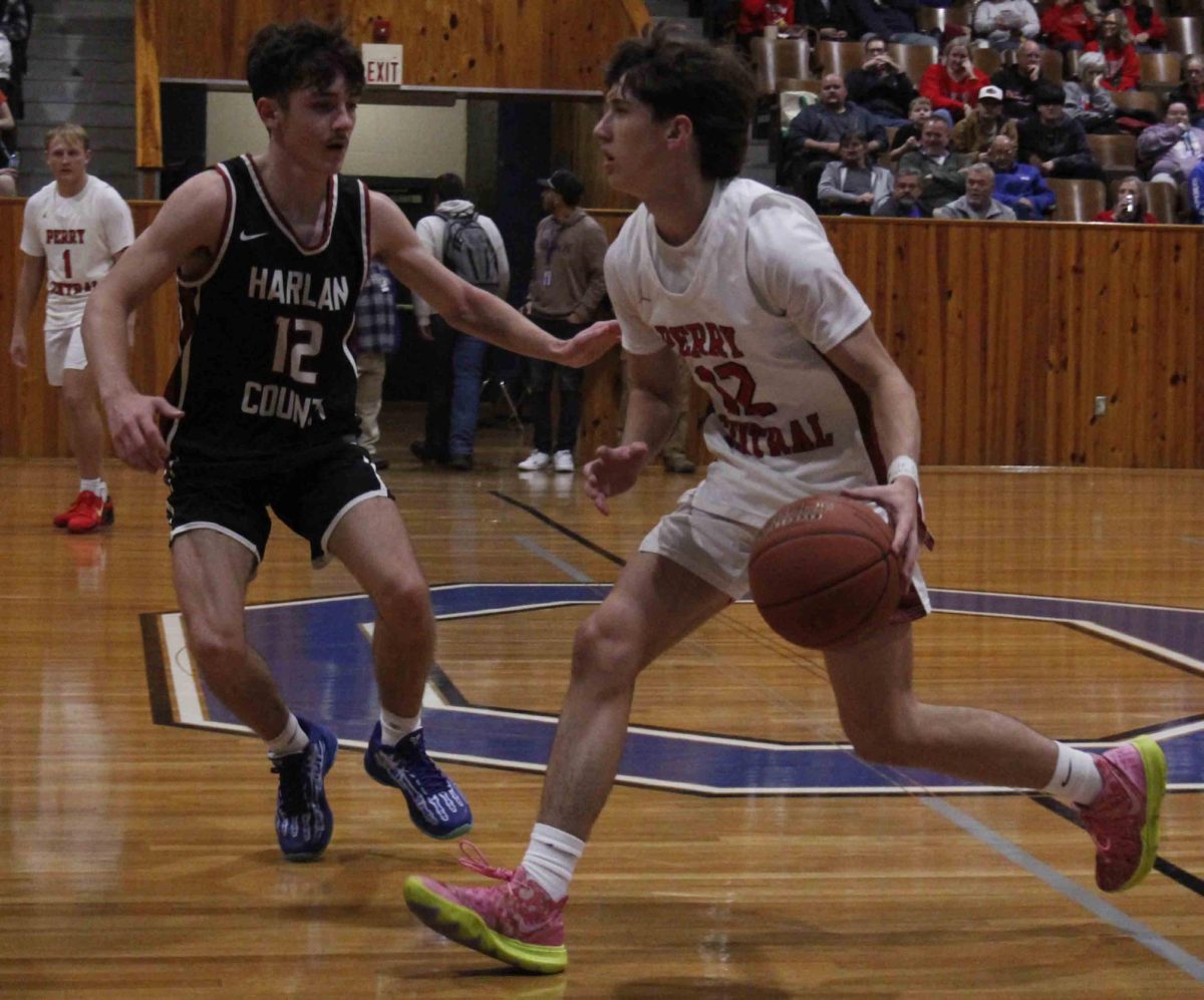 Harlan County guard Trent Cole guarded Perry Central's Landon Miller in Monday's season opener for both teams at Oneida Baptist. The Bears limited Perry to 30 percent shooting on the way to an 87-47 victory.