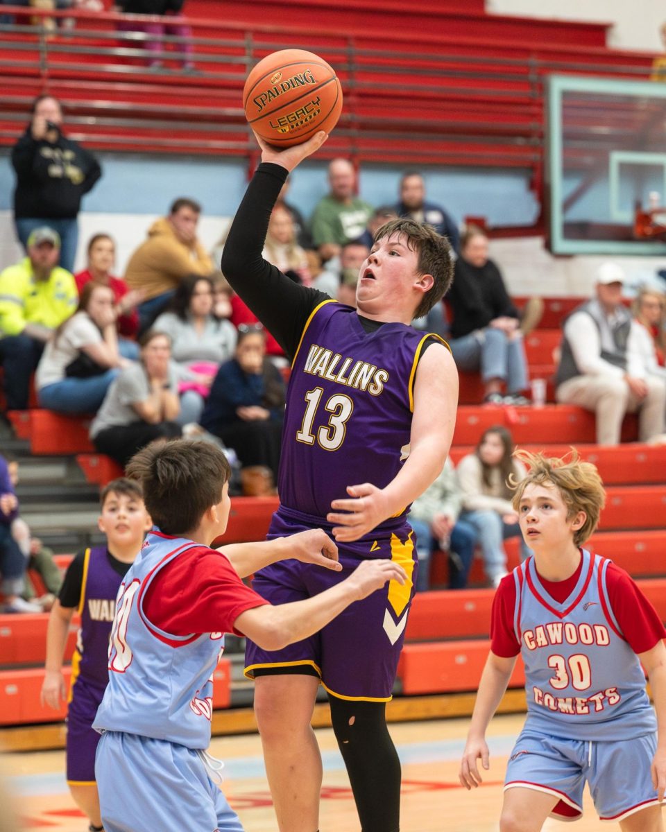 Wallins center Leland Cope put up a shot in the Devils' win over Cawood in the fifth- and sixth-grade county tournament semifinals on Thursday.