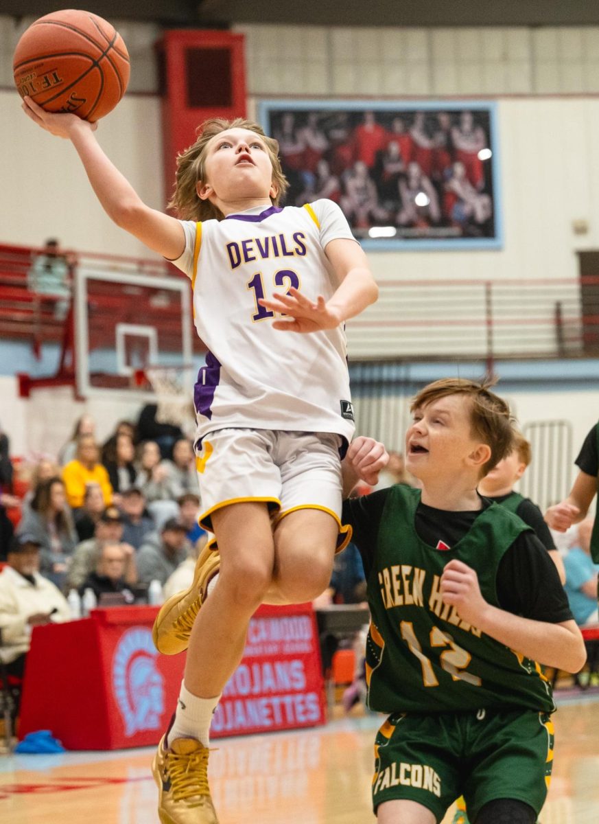 Wallins guard Sam Carmical sailed in for two of his 16 points Tuesday in the Purple Devils' 38-15 victory over Green Hills in county tournament action.