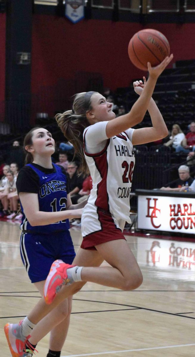 Harlan County's Lauren Lewis worked inside for a shot in Friday's game against Oneida Baptist.