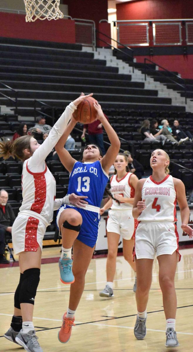 Corbin's Kalley Stewart challenged a Lauren McGeorge shot in Wednesday's 2A Section 7 Tournament game at Harlan County. Corbin advanced to the semifinals with an 83-57 victory.