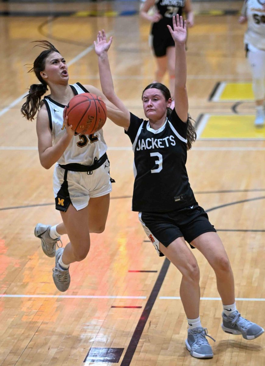 Middlesboro freshman Emily Lambert sailed past Williamsburg's Hannah Creekmore for two of her 15 points Sunday in the Lady Jackets' 66-39 win over Williamsburg in the 13th Region All "A" Classic. Middlesboro will play Pineville in the tournament semifinals on Monday.
