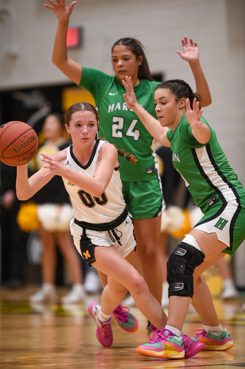 Harlan seniors Aymanni Wynn (24) and Kylie Noe trapped Middlesboro guard Morgan Martin in action from the 13th Region All "A" Classic finals Tuesday. Wynn finished with 24 points and 20 rebounds in her final All "A" Classic game, but Middlesboro pulled away late for a 62-53 victory.