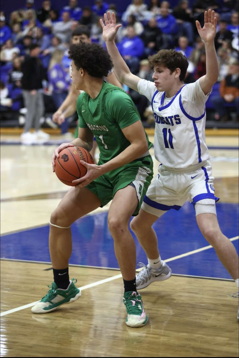 Harlan freshman forward Braxton Rowe worked against Bell County's Jaxon Thomas in Tuesday's district clash. Thomas scored 15 points in the Bobcats' 81-41 victory.