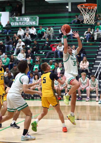 Harlan freshman center Kobe Noe went in for two of his 17 points in the Green Dragons' 59-58 win over visiting Middlesboro on Friday. Noe hit the game-winning free throw with six-tenths of a second left.