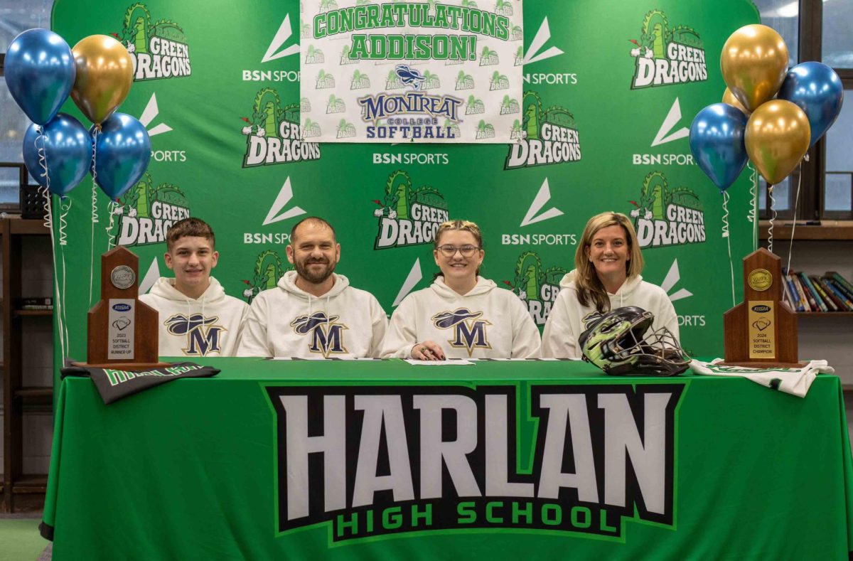 Harlan senior Addison Jackson signed with Montreat College on Friday to continue her athletic and academic career. She is pictured with her brother, Caiden Jackson, and her parents, Jason and Hope Jackson.