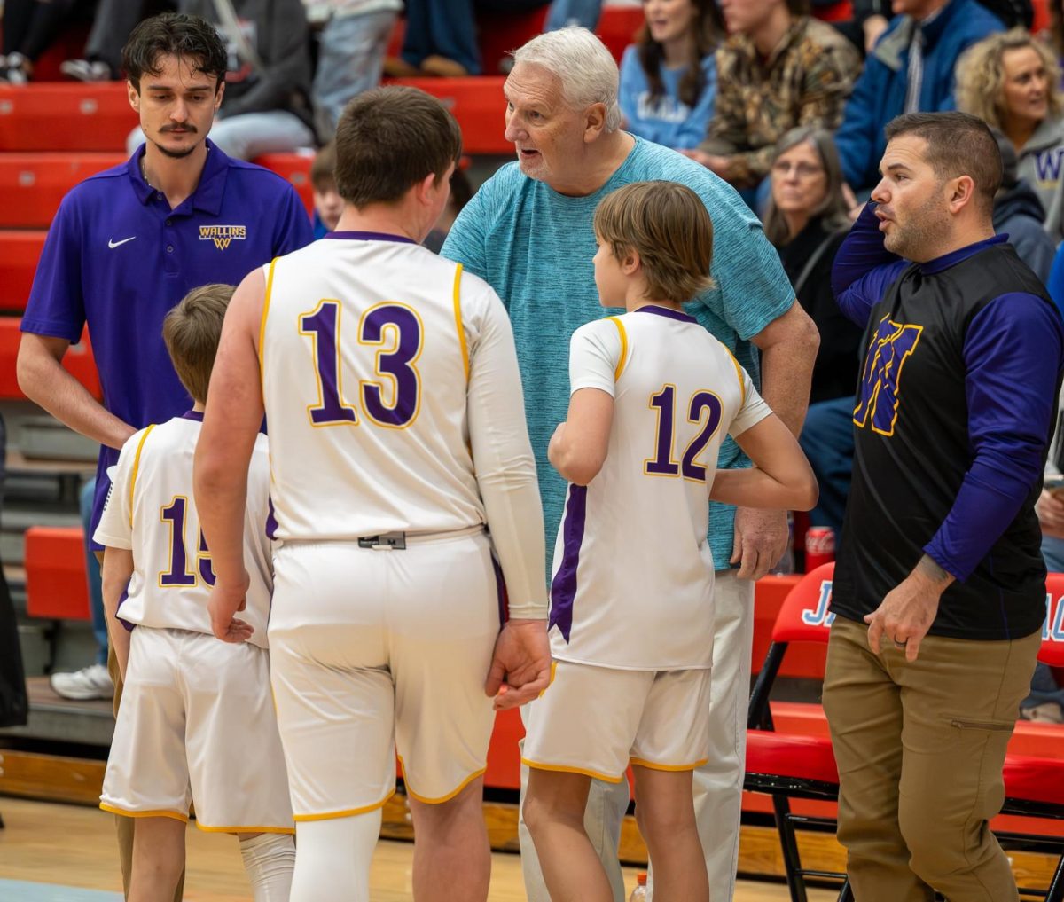 Former Cawood all-stater Greg Coldiron, who later served as a high school basketball coach, was back in coaching this season as an assistant for the Wallins basketball teams led by his grandson, Treyce Spurlock, who starred at Harlan County High School and later played at Morehead. Coldiron was the first all-state player at Cawood High School and first Kentucky All Star from Cawood, both in 1978. He went on to play four seasons at Morehead State University, and then returned home to begin his coaching career. He was an assistant coach at Cawood under Mike Jones when the Trojans won a 52nd District Tournament title in 1986 and finished as 13th Region runner-up. He became the head coach at Cawood in the 1990 season and led the Trojans to district titles in 1991 and 1992. He later led Powell County to a 14th Region title. He was also a head coach at Maysville and Russell County.