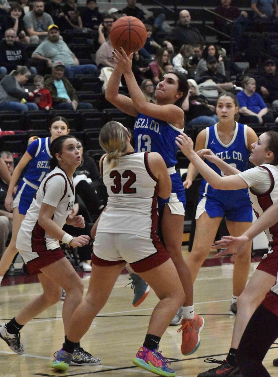 Bell County senior guard Lauren McGeorge went up for a shot in Tuesday's district game at Harlan County. McGeorge scored 22 points in the Lady Cats' 53-46 win.