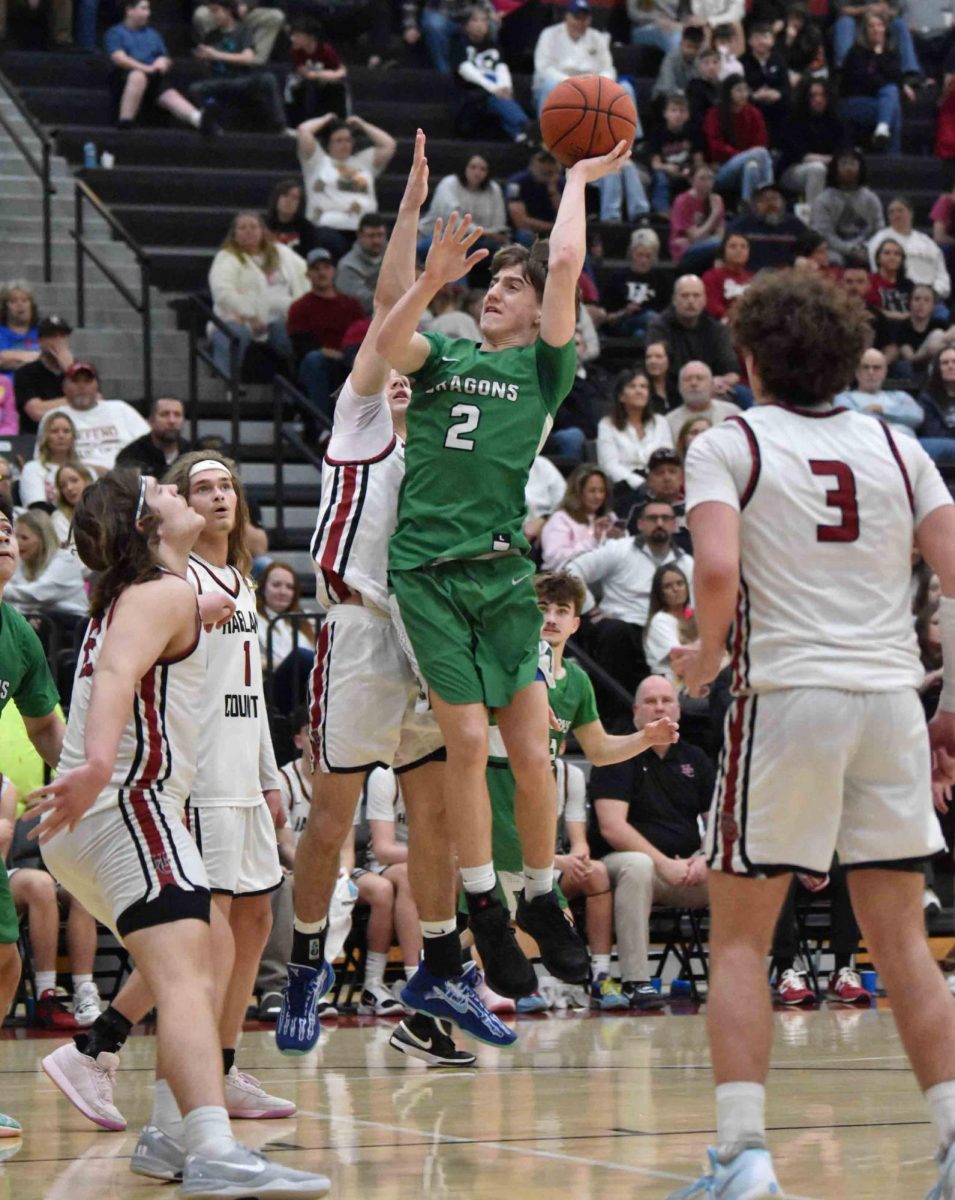 Harlan guard Jaxson Perry put up a shot in Friday's game at Harlan County.