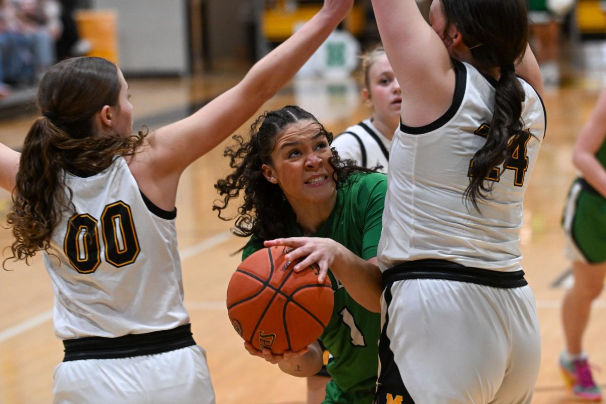 Harlan senior forward Kylie Noe was surrounded by Middlesboro Lady Jackets in Tuesday’s 62-54 win.
