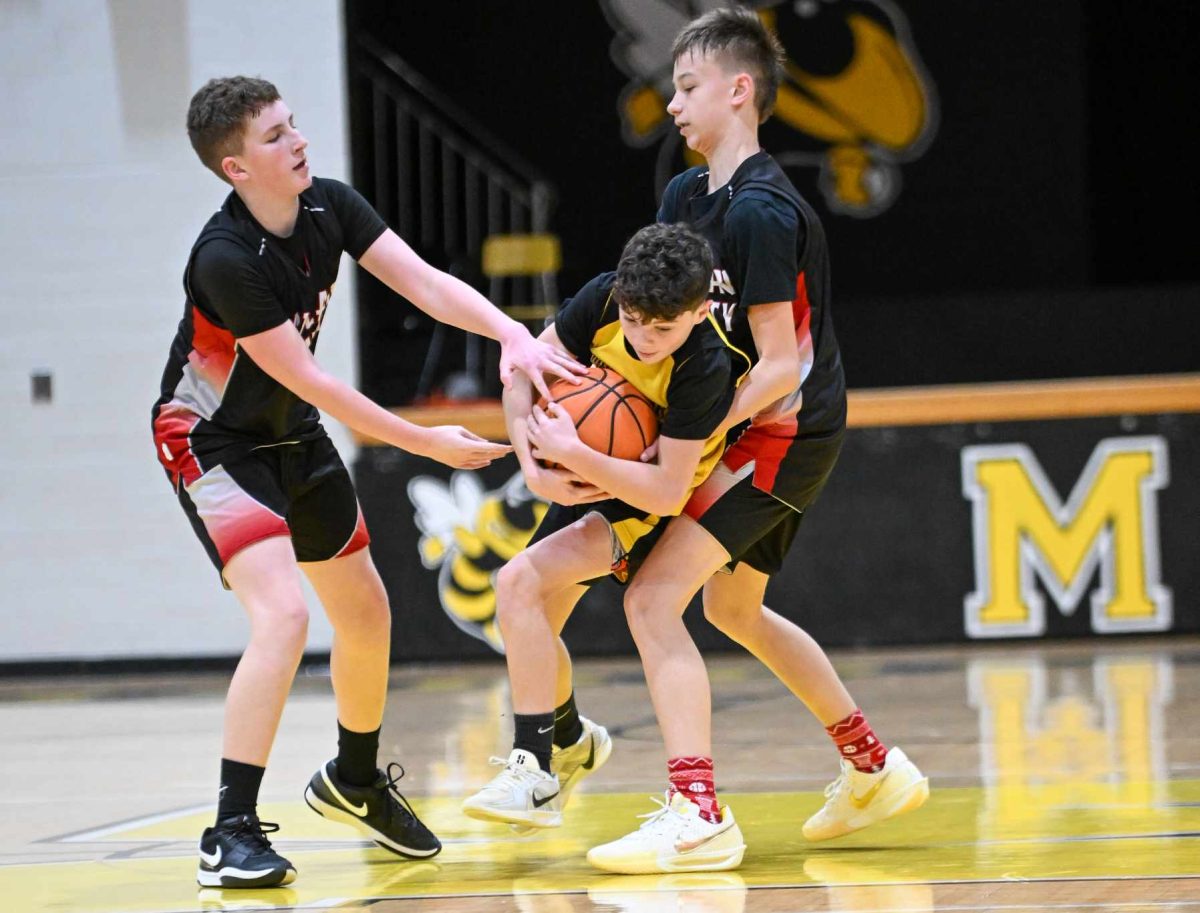 Trey Creech and Taylor Daniels worked together on defense in middle school basketball action earlier this season. The Harlan County seventh-grade team fell by two points to eventual champ North Laurel in the semifinals of the regional seventh-grade tournament on Saturday at Knox Central.