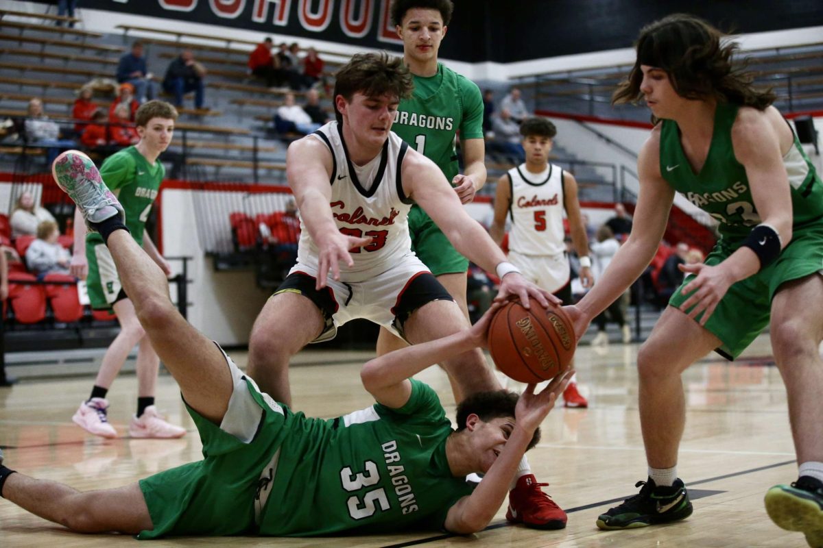 Harlan freshman center Kobe Noe went to the floor for a loose ball in Friday’s game at Whitley County.
