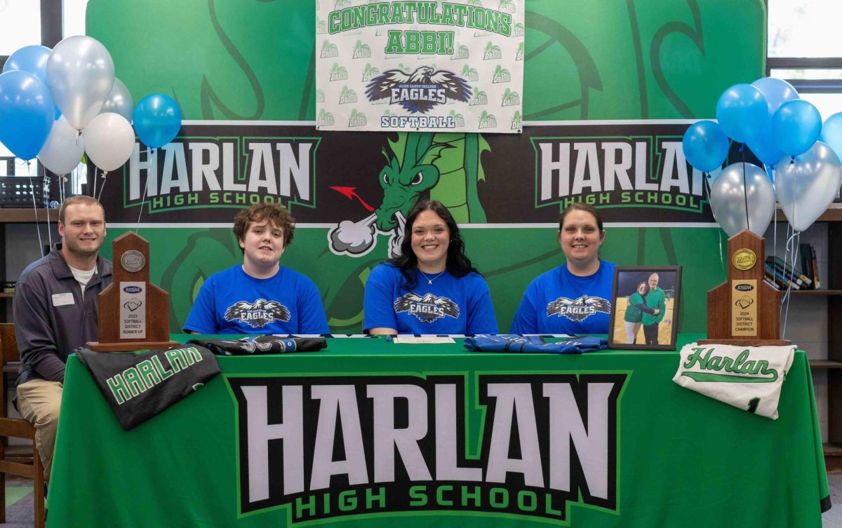 Harlan senior first baseman Abbi Fields signed with Alice Lloyd College on Tuesday to continue her academic and athletic careers. Pictured with Fields are, from left: Alice Lloyd assistant coach Mason Schroeder, her brother Adrian Fields, and mom, Jessica Hubbard.