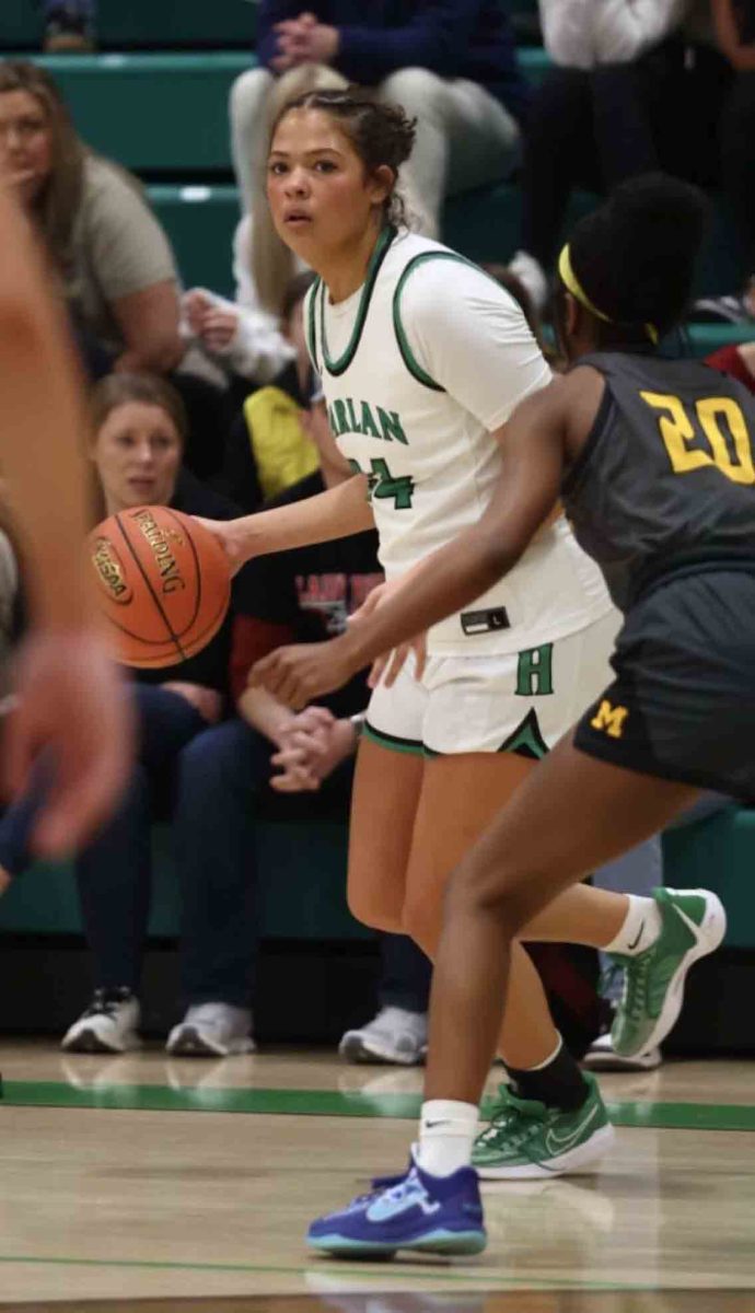 Harlan guard Aymanni Wynn worked against Middlesboro's Keevi Betts in action from the 52nd District Tournament. Wynn scored 11 points, including two late free throws, as the Lady Dragons advanced with a 66-61 win.