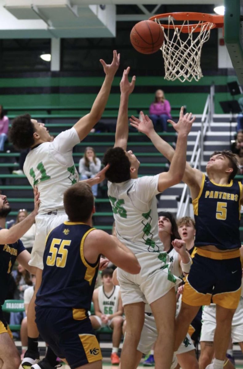 Harlan freshman forwards Braxton Rowe (11) and Kobe Noe battled for a rebound in Friday’s loss to visiting Knox Central.
