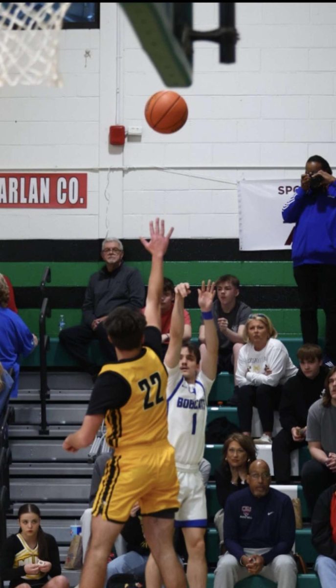 Bell County senior guard Cameron Hall lofted a shot over a Middlesboro defender during the Bobcats' win in the 52nd DIstrict Tournament.