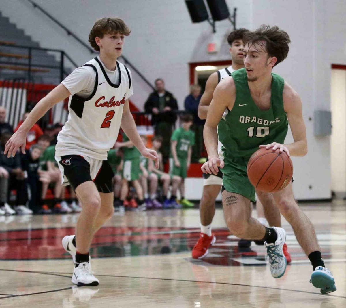 Harlan guard Dylan Cox worked against Whitley County's Bryson Mahan in Tuesday's game. Cox scored 16 points in the Dragons' 80-57 loss.