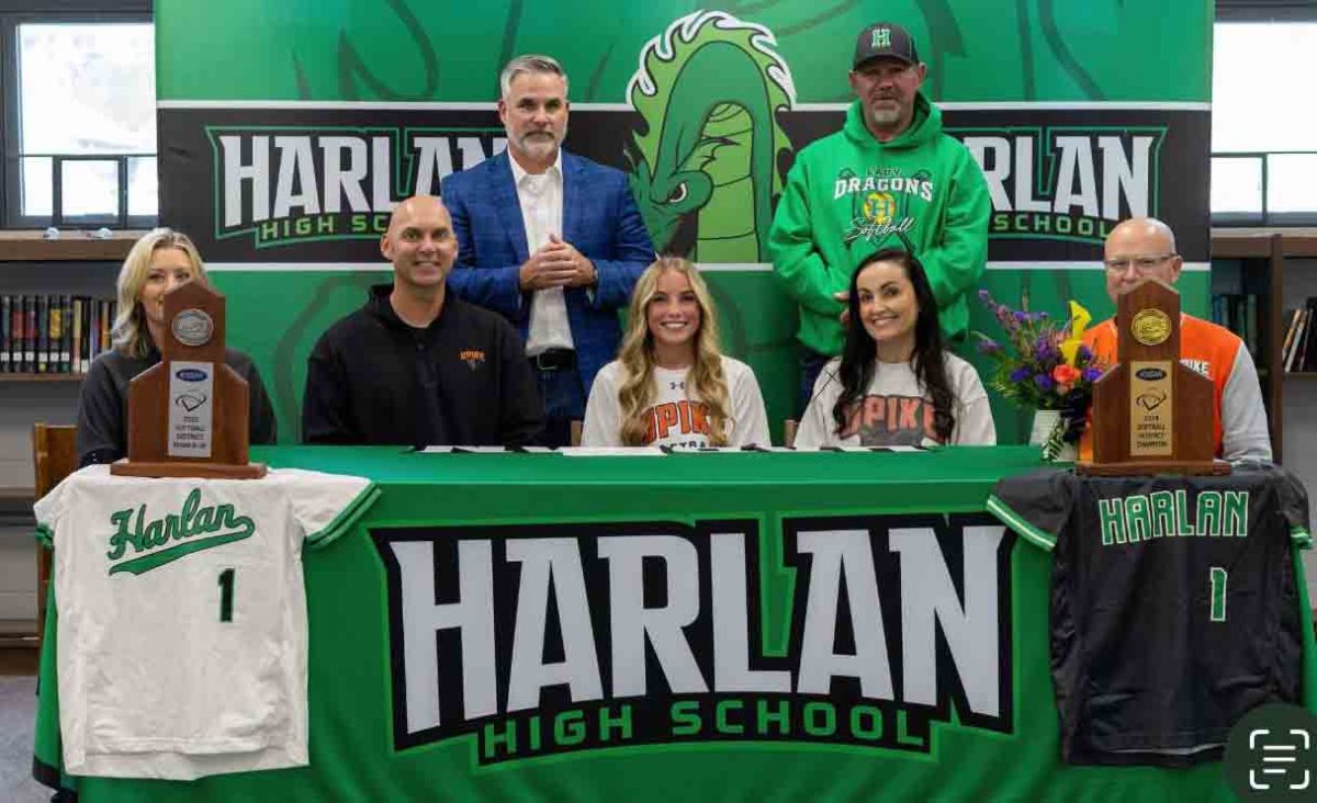 Ella Farley signed recently with the University of Pikeville to continue her academic and athletic career. Pictured with Farley are, from left, front row: Kristi Farley, Rob Farley, Ella Farley, Jennifer Saylor and University of Pikeville coach Robert Staggs; back row: Harlan coaches Scott Lisenbee and David Overbay.