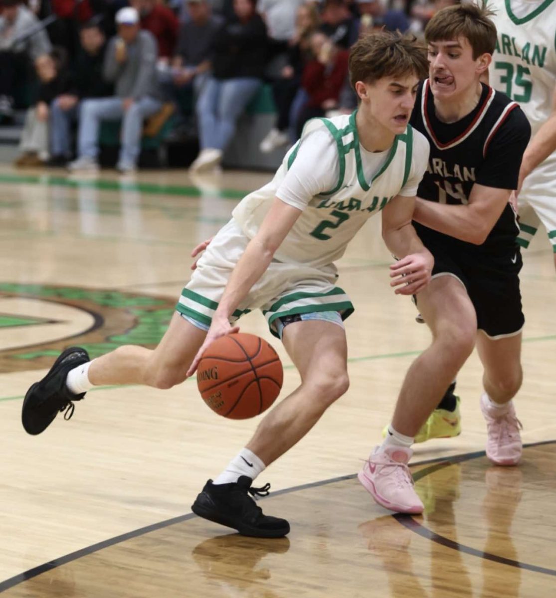 Harlan guard Jaxson Perry, pictured in action earlier this season, led the Green Dragons with 11 points in a loss Thursday at Knott Central.