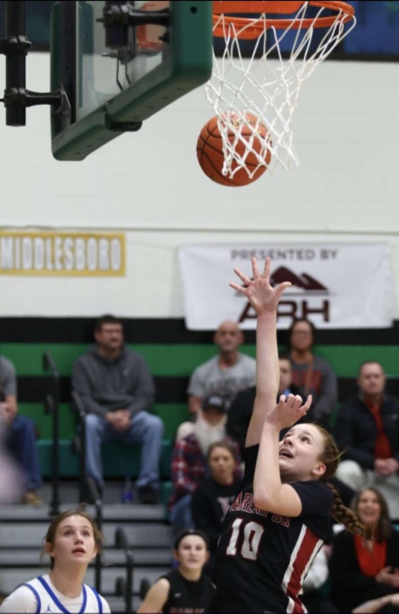 Harlan County eighth-grade guard Jaycee Simpson went inside for two of her 14 points Monday in the Lady Bears' 59-51 win over Bell County in the 52nd District Toumament.