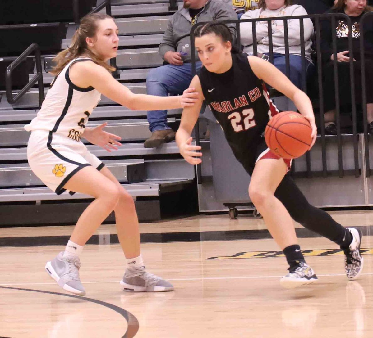 Harlan County freshman guard Kylee Runions worked around a Clay County defender in Saturday's game in Manchester. Runions led the Lady Bears with 15 points in a 55-42 loss.