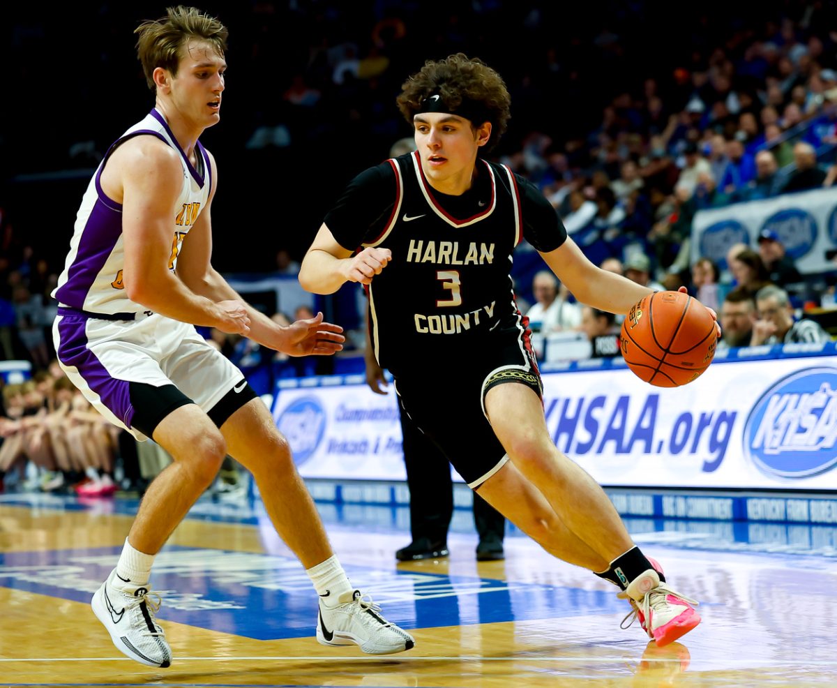 Harlan County guard Maddox Huff, pictured in action against Lyon County's Travis Perry in last year's state finals, was named the KABC Player of the Year in the 13th Region on Friday. Huff is averaging 29.6 points and 8.3 rebounds per game for the 22-8 Black Bears.