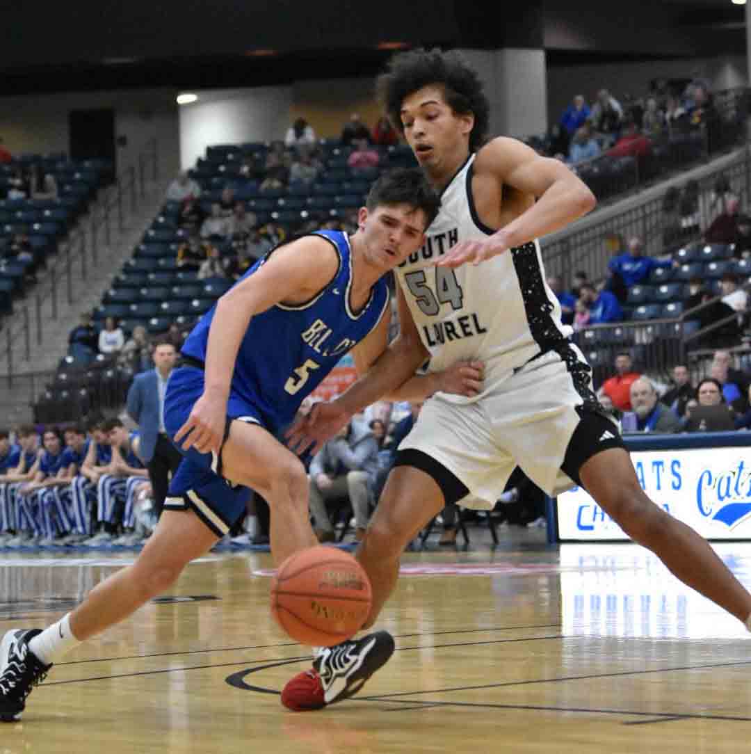 Bell County guard Blake Burnett worked against South Laurel's Jordan Mabe in action from the 13th Region Tournament on Thursday. Mabe led the Cardinals with 22 points and had a big game on defense as South advanced with a 59-43 victory.