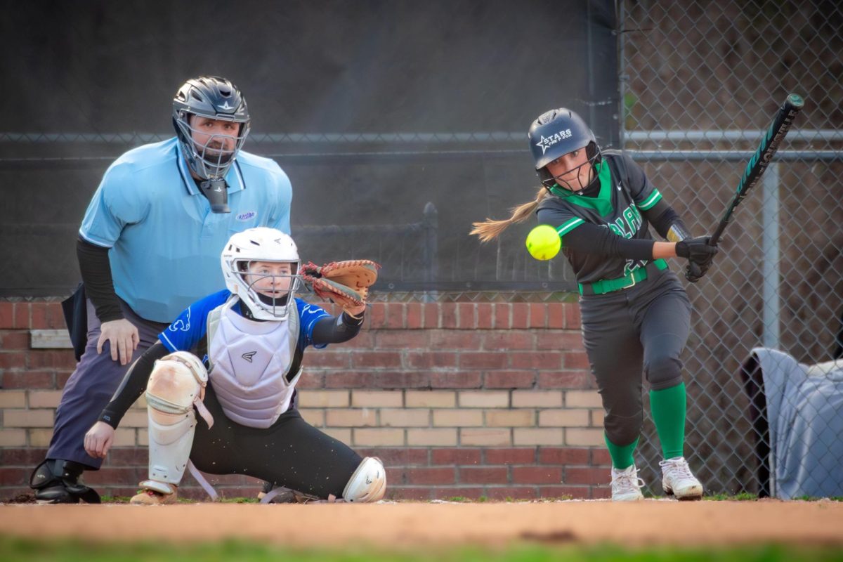 Harlan shortstop Ella Farley made contact with a pitch in Friday's game against visiting Letcher Central. Harlan rallied to force extra innings before falling 13-8. The Lady Dragons bounced back Saturday with wins over Powell County and Lynn Camp.