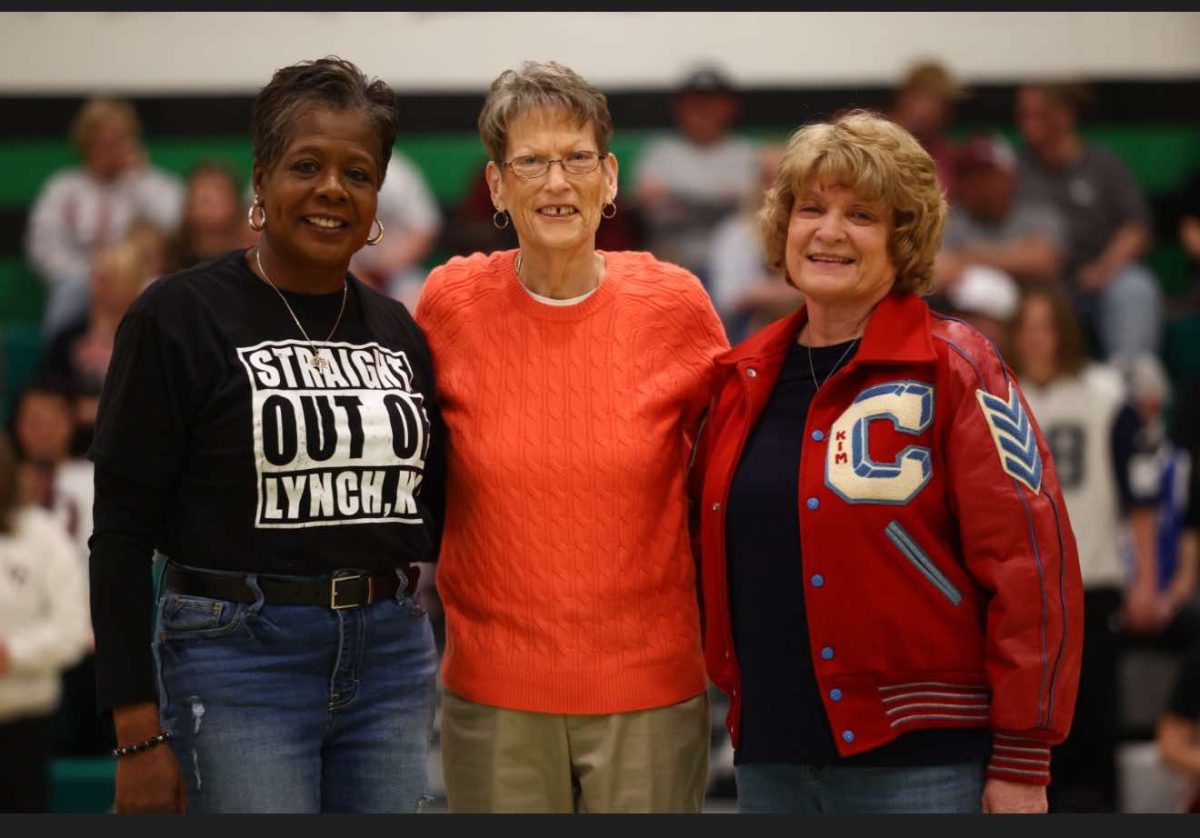 Three players from the first 52nd District Tournament held in 1975 at Harlan High School were honored at halftime of this year's championship game Thursday. The former players included Kathy Thomas, who played at Lynch; Maralee Holder, who played at Harlan; and Kim Kelley, who played at Cawood.