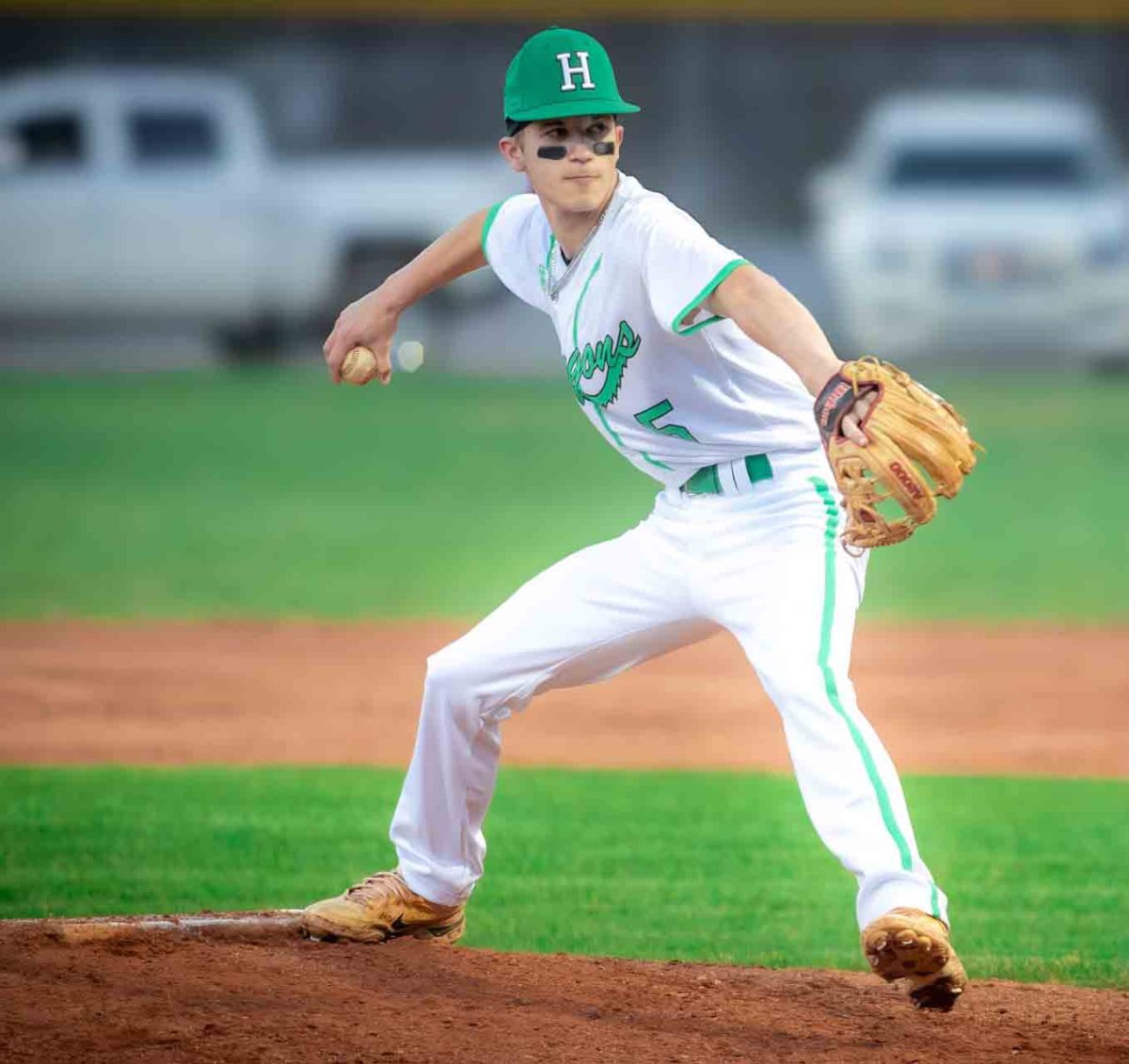 Harlan junior Jake Brewer was the winning pitcher and collected three hits as the Green Dragons routed visiting Pineville 15-0 on Monday.