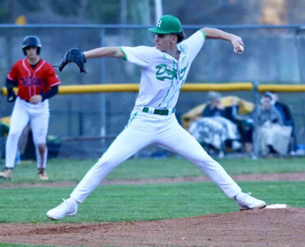 Harlan sophomore Luke Luttrell worked to a South Laurel batter in the Dragons' home opener Tuesday. The Cardinals won 10-2.