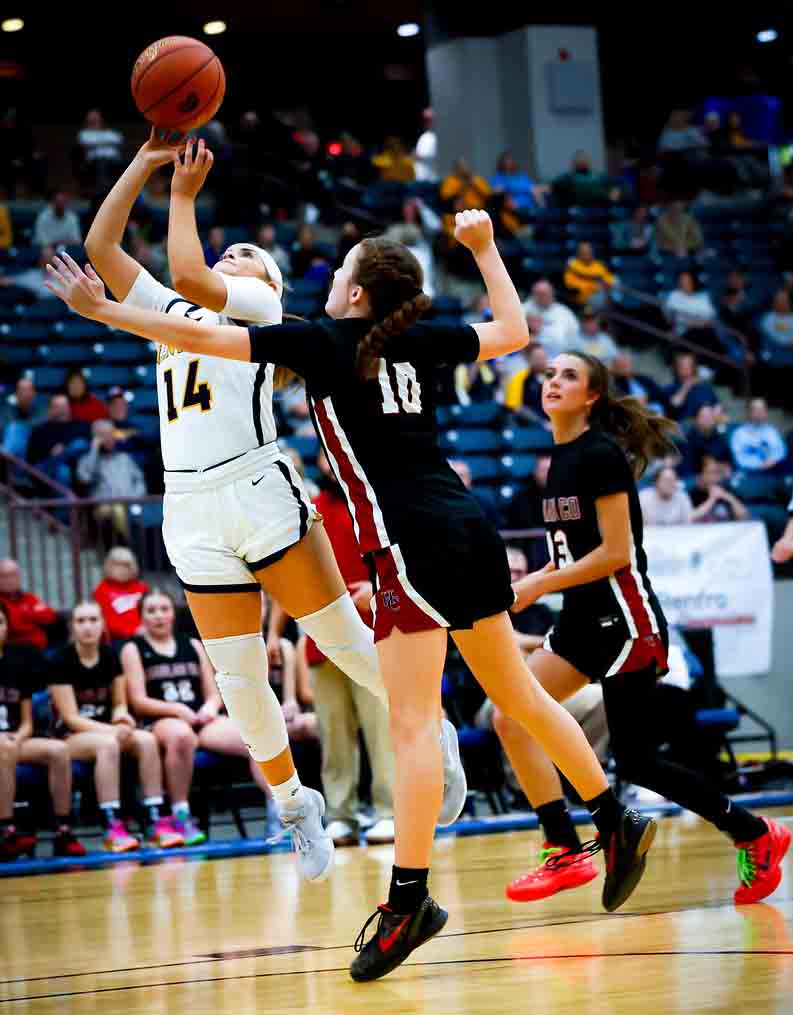 Sophomore guard Shelbie Mills worked inside for a shot over Harlan County’s Jaycee Simpson in 13th Region Tournament action. Mills scored 28 points as the Lady Panthers advanced with a 70-41 victory.