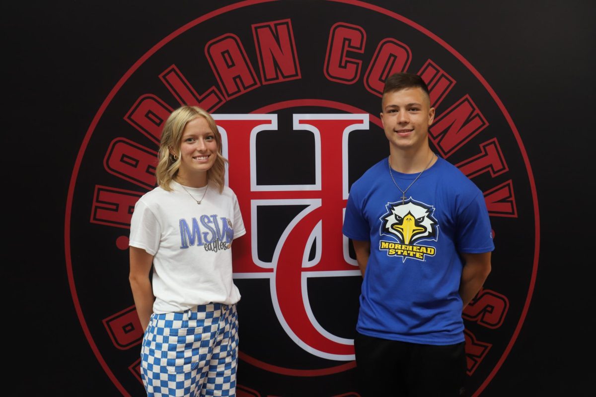 Peyton Lunsford and Luke Kelly became the first Harlan County High School athletes to sign with a Division I school for track and cross country when they both signed with Morehead State University on Wednesday.