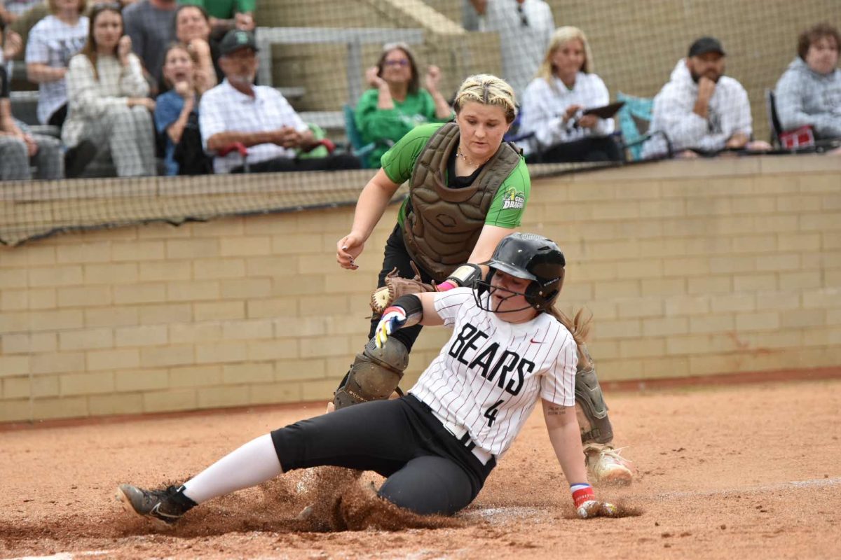 Harlan catcher Addison Jackson tagged out Harlan County's Halanah Shepherd as part of a double play in the second inning of a district clash Thursday at HCHS. The visiting Lady Dragons won 9-1.
