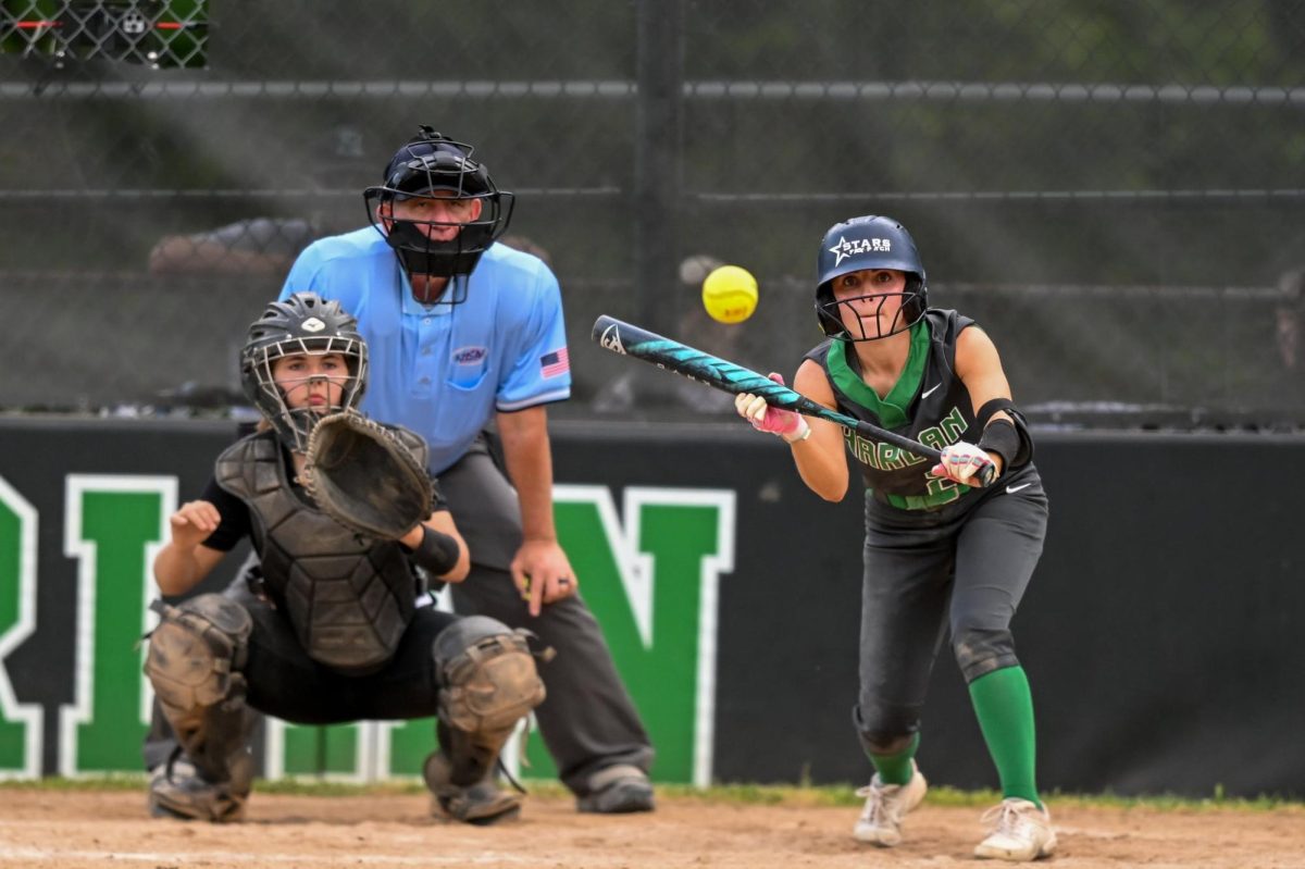 Harlan senior Ella Farley connected on one of her two hits Wednesday in the Lady Dragons’ 7-1 win over Harlan County in the 52nd District Tournament finals.
