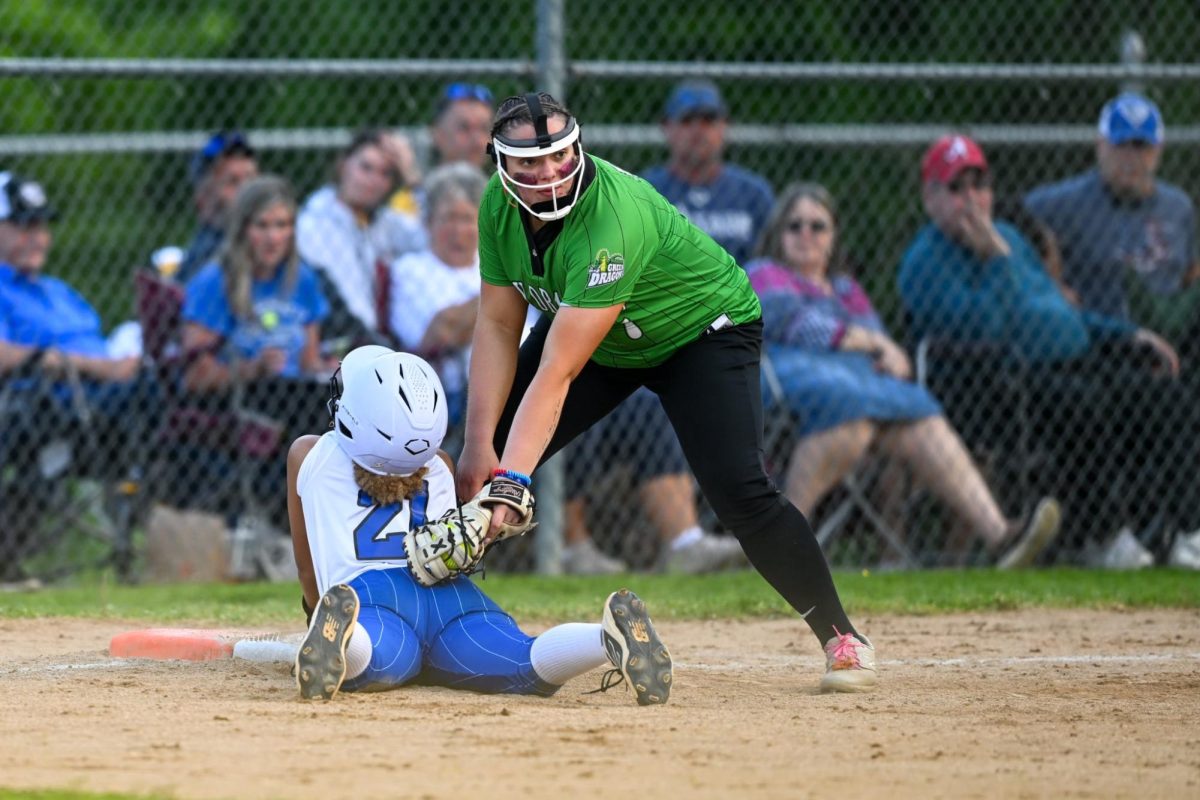 Harlan first baseman Abbi Fields tagged Bell County's Jayda Boateng as she got back to the bag during 52nd District Tournament action Monday. Fields homered in the Lady Dragons' 9-0 victory.