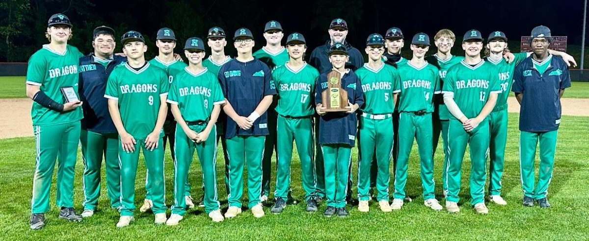 
The Harlan Green Dragons are pictured with their championship trophy after rallying for a 5-4 win over Bell County on Friday at Harlan County High School for their second straight 52nd District Tournament championship. It was the first time Harlan has won consecutive district titles since 1997 and 1998 and the third time since winning four straight from 1956 to 1959.