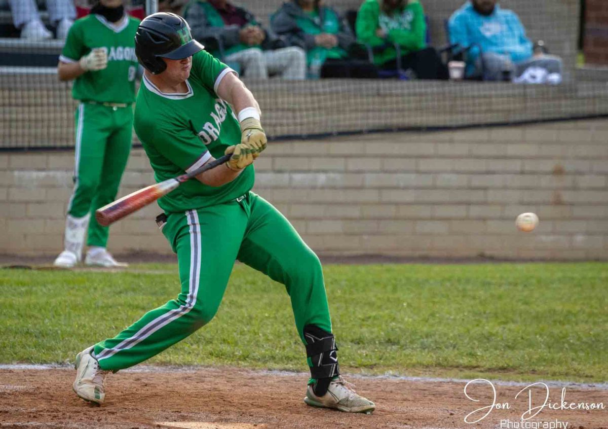 Harlan first baseman Jared Moore had the game-winning hit Friday as the Green Dragons rallied for a 5-4 win over Bell County in the 52nd District Tournament finals at Harlan County.