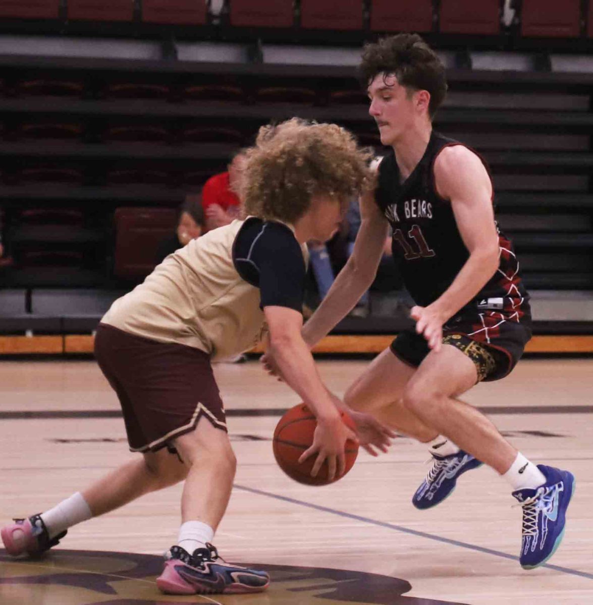 Harlan County's Trent Cole moved in on defense against Pineville's Preston Zachery in the opening summer scrimmage for both teams. Cole led the Bears with 22 points in a 68-32 victory.