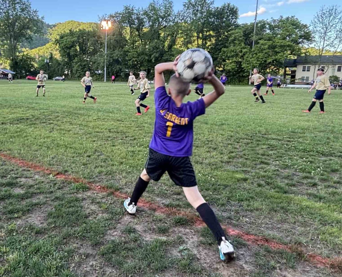 Jaden Sargent took a throw-in for Wallins in the Devils' first-round loss to Evarts on Tuesday in the county soccer tournament.