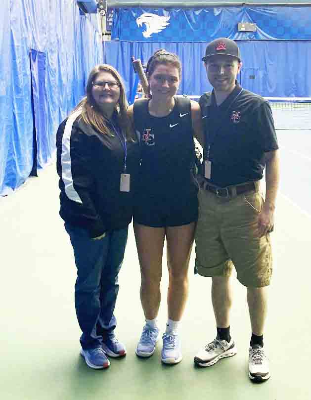Harlan County junior Kalista Dunn became the first student-athlete from HCHS to participate in the state tennis tournament earlier this week. She is pictured with coaches Erica Moore and Caleb Bailey.