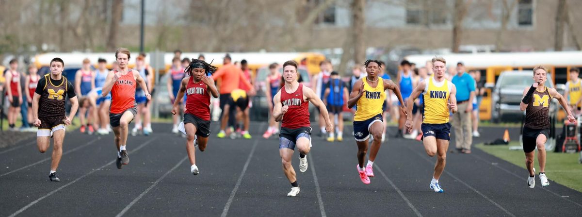 Harlan County senior Luke Kelly (center) won both the 100- and 200-meter dashes last week at the Leslie County meet.