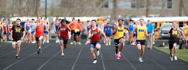 Harlan County senior Luke Kelly (center) won both the 100- and 200-meter dashes last week at the Leslie County meet.