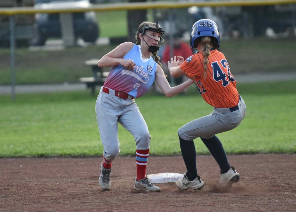 Harlan All-Stars shortstop Andrea Napier tagged out a Hazard/Perry base runner in action from the District 4 Tournament at Huff Park. Harlan advanced with an 18-8 victory.