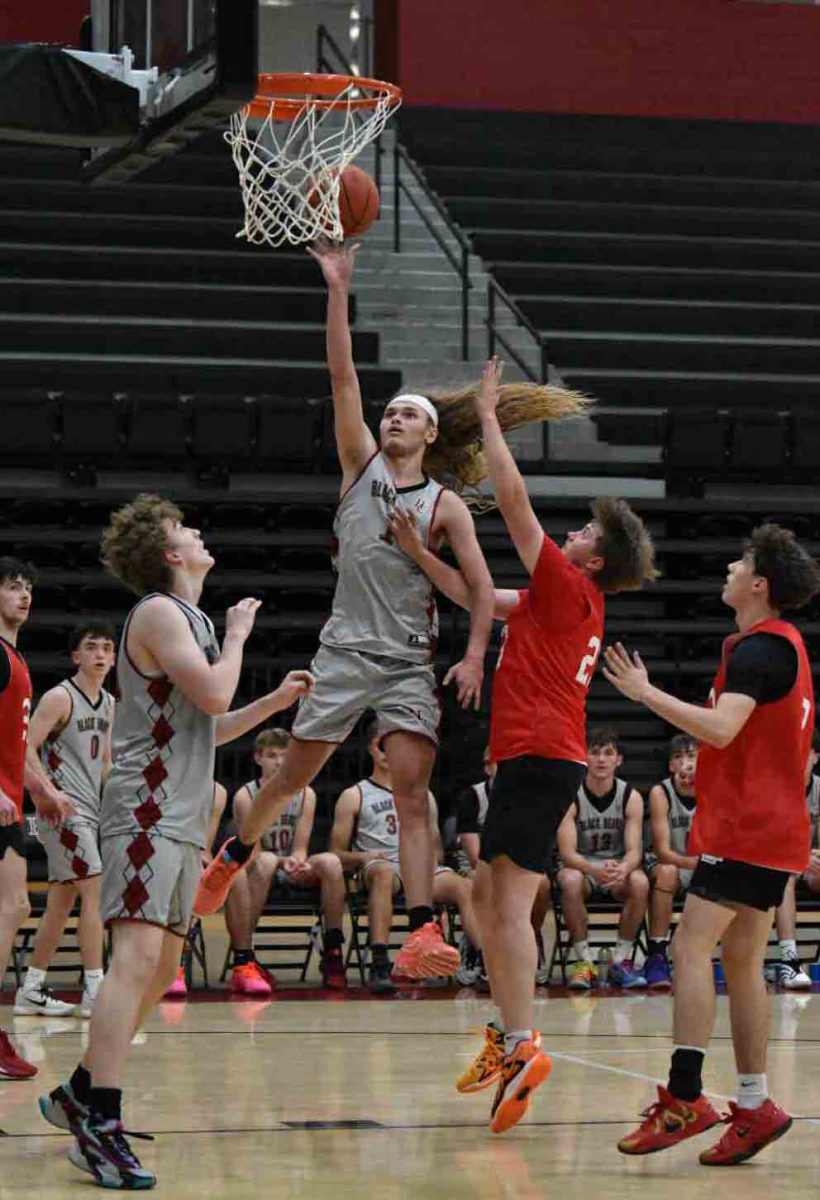 Harlan County senior guard Reggie Cottrell worked inside for two of his 21 points Tuesday in scrimmage against Perry Central. The Commodored edged HCHS 54-48. Cottrell scored 20 in the Bears' 62-42 win over Knott Central earlier in the day.